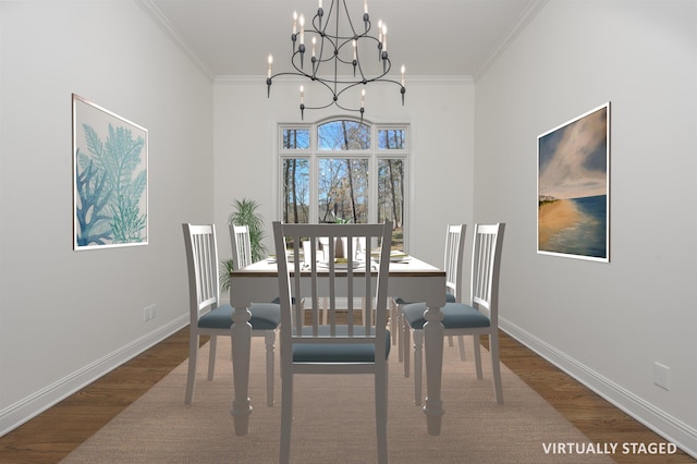 dining room featuring wood finished floors, baseboards, and ornamental molding