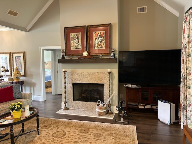 living room with lofted ceiling, ornamental molding, and dark hardwood / wood-style floors