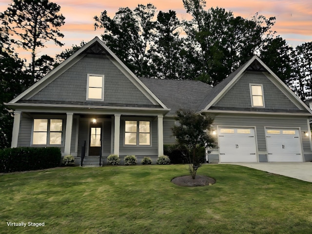 craftsman-style home featuring a lawn