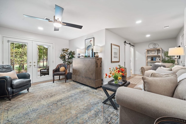 1011 Cartwright Ln, Greensboro, GA 30642 - living area with a barn door, a ceiling fan, recessed lighting, and french doors