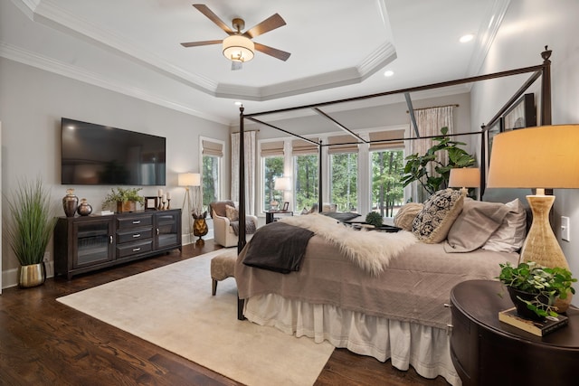 1011 Cartwright Ln, Greensboro, GA 30642 - bedroom featuring multiple windows, wood finished floors, a raised ceiling, ornamental molding, and recessed lighting