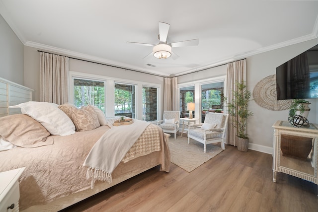 1011 Cartwright Ln, Greensboro, GA 30642 - bedroom with wood finished floors, ornamental molding, and ceiling fan