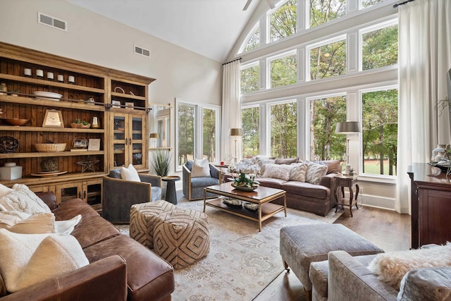 1011 Cartwright Ln, Greensboro, GA 30642 - living area with high vaulted ceiling and wood finished floors