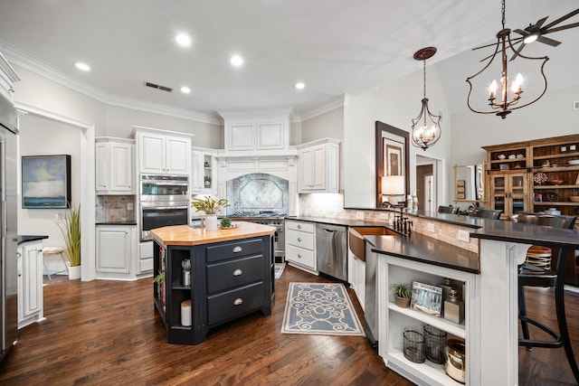1011 Cartwright Ln, Greensboro, GA 30642 - kitchen featuring open shelves, appliances with stainless steel finishes, wood counters, white cabinetry, and a chandelier