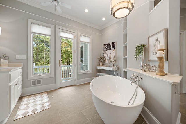 1011 Cartwright Ln, Greensboro, GA 30642 - bathroom with a freestanding bath, vanity, crown molding, built in shelves, and ceiling fan