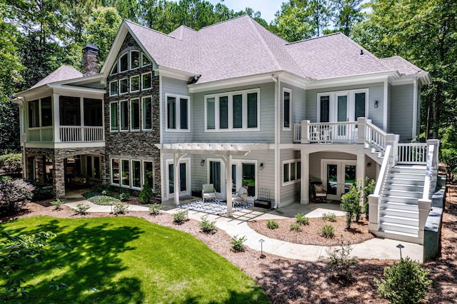 1011 Cartwright Ln, Greensboro, GA 30642 - rear view of property featuring french doors, a chimney, a patio, stairs, and roof with shingles