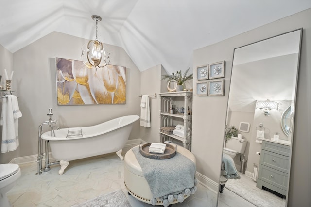1011 Cartwright Ln, Greensboro, GA 30642 - bathroom with vanity, a freestanding bath, lofted ceiling, and marble finish floors