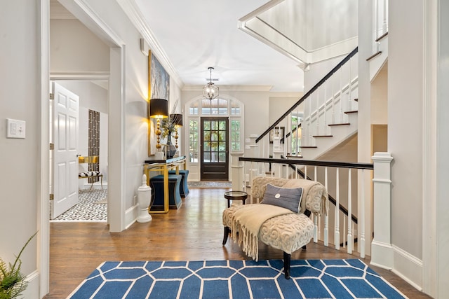 1011 Cartwright Ln, Greensboro, GA 30642 - foyer featuring wood finished floors, crown molding, stairway, and a chandelier