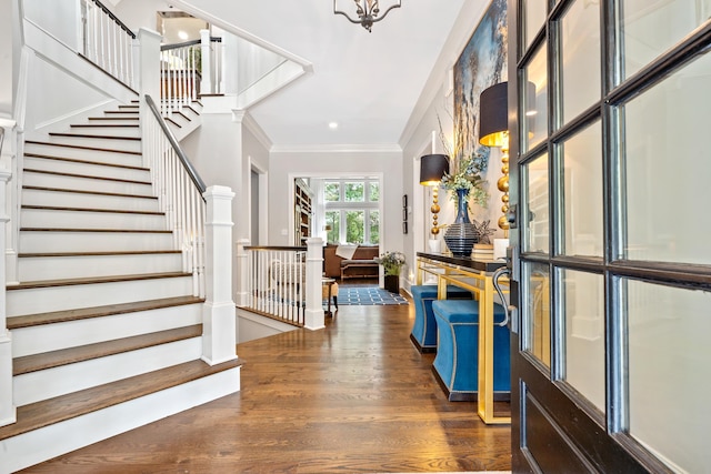 1011 Cartwright Ln, Greensboro, GA 30642 - entrance foyer featuring ornamental molding, dark wood-type flooring, and stairs