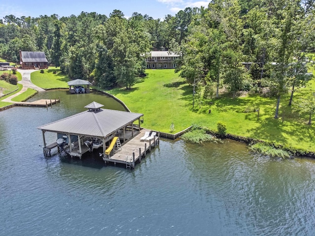 dock area featuring a water view and a lawn