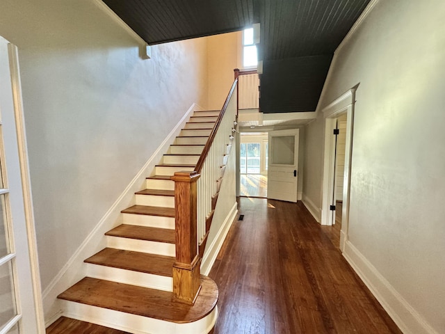 staircase featuring hardwood / wood-style floors