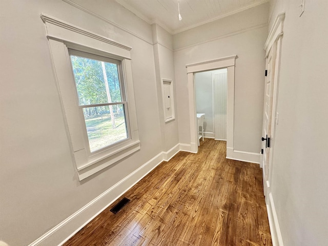 corridor featuring crown molding and hardwood / wood-style floors