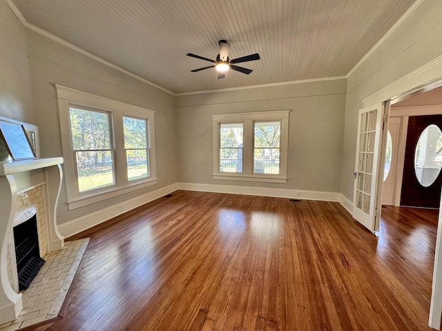 unfurnished living room featuring crown molding, hardwood / wood-style floors, and ceiling fan