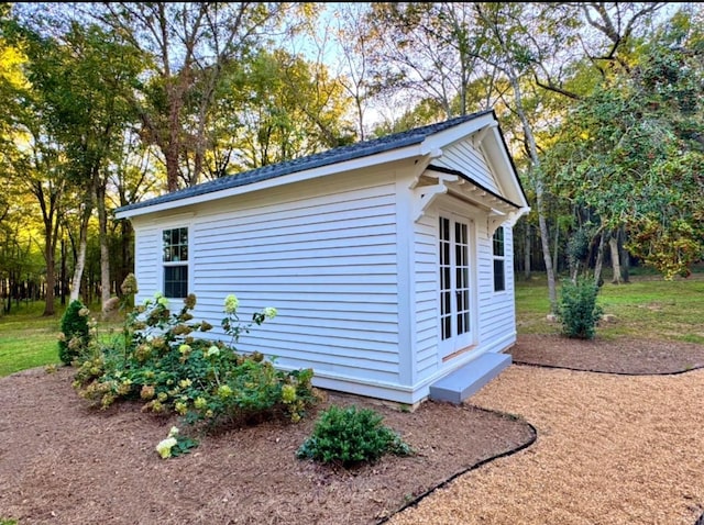 view of property exterior featuring an outdoor structure