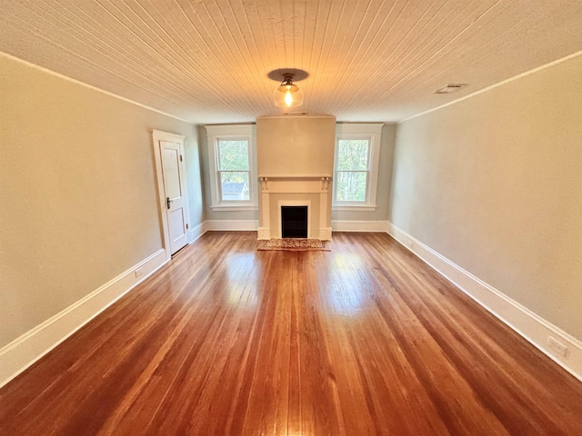 unfurnished living room featuring hardwood / wood-style flooring and wooden ceiling