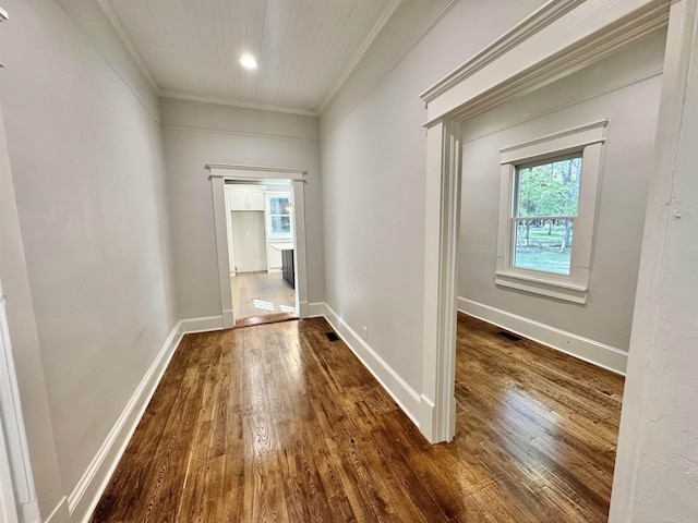 hall with crown molding and dark hardwood / wood-style flooring