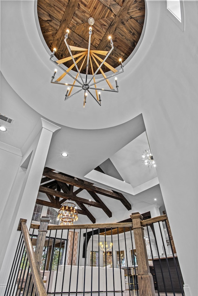 1031 Fish Trap Shls, Greensboro, GA 30642 - detailed view of a chandelier, ornate columns, recessed lighting, a raised ceiling, and wood ceiling with exposed beams