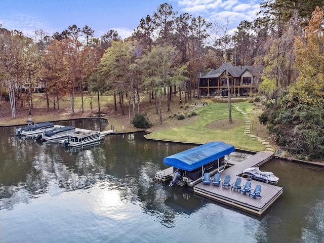1031 Fish Trap Shls, Greensboro, GA 30642 - dock area with boat lift, a water view, a yard, and view of wooded area