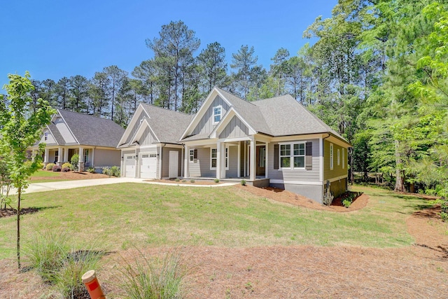 craftsman house featuring a garage, a porch, and a front yard