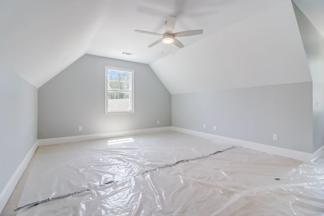 additional living space featuring ceiling fan and vaulted ceiling