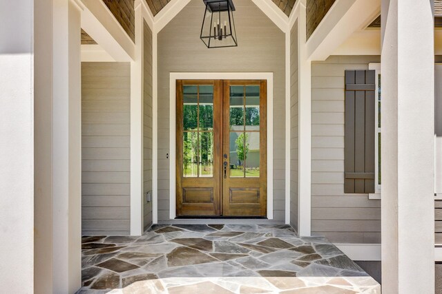 view of exterior entry featuring french doors