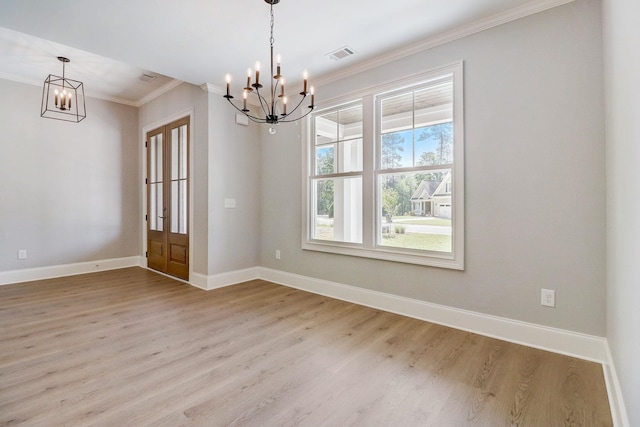 interior space with ornamental molding, light hardwood / wood-style floors, and a notable chandelier