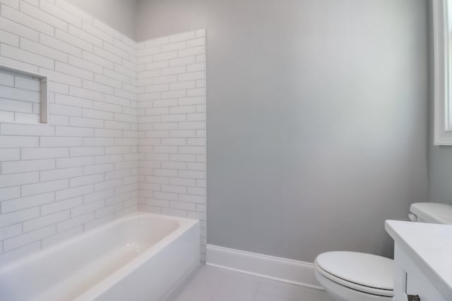 full bathroom featuring tile patterned floors, vanity, toilet, and tiled shower / bath combo