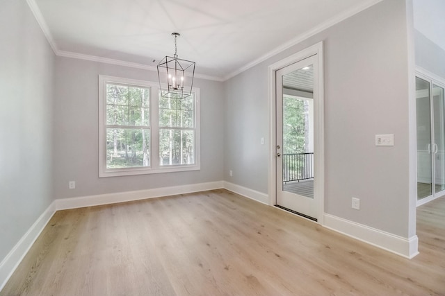 unfurnished room with crown molding, an inviting chandelier, and light wood-type flooring