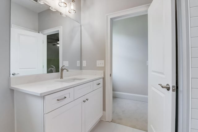 bathroom with tile patterned floors and vanity