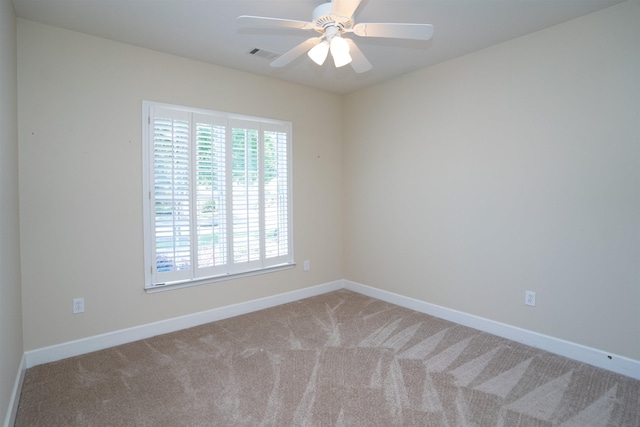 carpeted empty room with ceiling fan