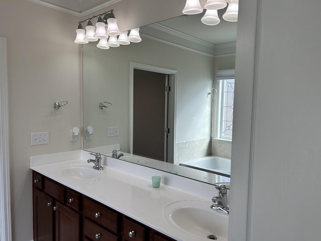 bathroom featuring crown molding, a washtub, and vanity