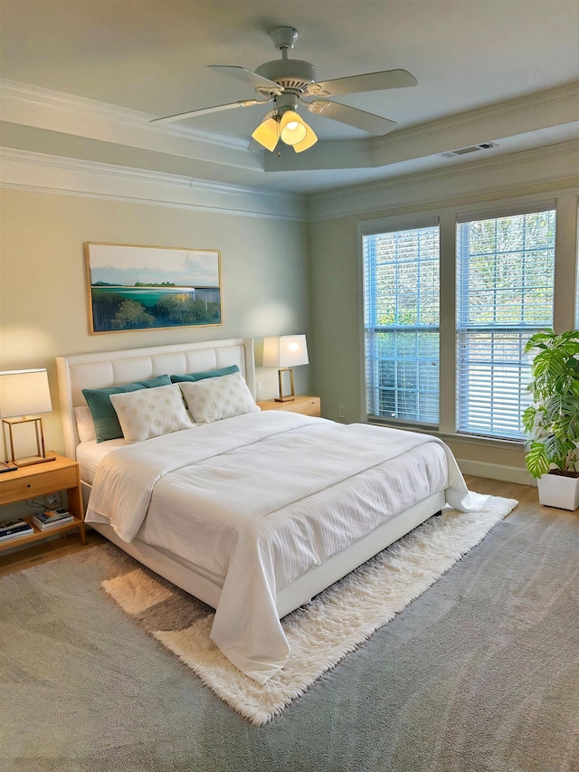 bedroom featuring crown molding and ceiling fan