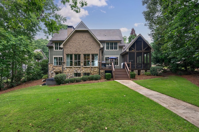 146 Long Island Dr, Eatonton, GA 31024 - view of front of house with a sunroom, stairway, a front lawn, a chimney, and a deck