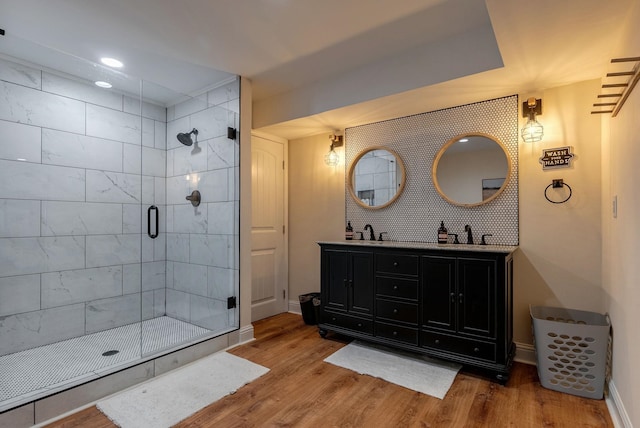 146 Long Island Dr, Eatonton, GA 31024 - full bathroom with wood finished floors, a stall shower, double vanity, and recessed lighting