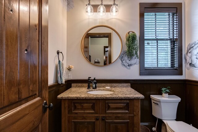 146 Long Island Dr, Eatonton, GA 31024 - bathroom featuring a wainscoted wall, vanity, healthy amount of natural light, and a decorative wall