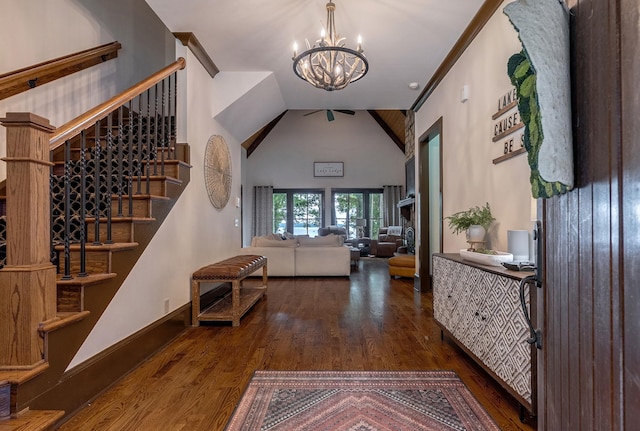 146 Long Island Dr, Eatonton, GA 31024 - entryway with a chandelier, wood finished floors, high vaulted ceiling, and stairs