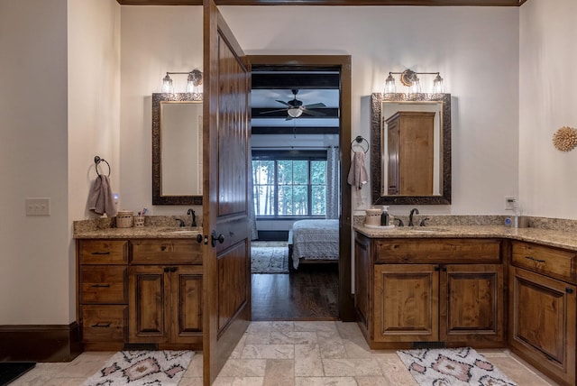 146 Long Island Dr, Eatonton, GA 31024 - full bathroom featuring two vanities, ensuite bathroom, stone finish flooring, and ceiling fan