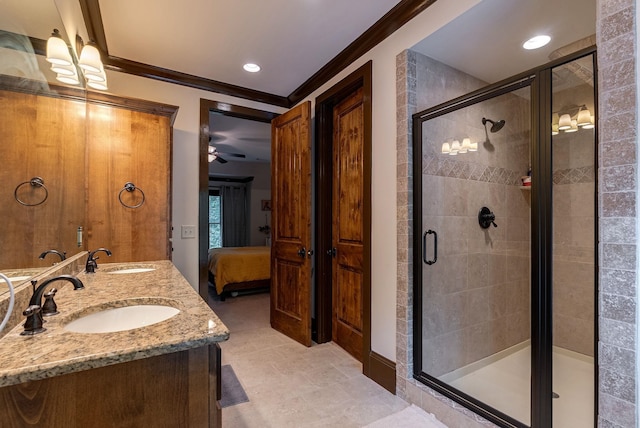 146 Long Island Dr, Eatonton, GA 31024 - ensuite bathroom featuring double vanity, ornamental molding, a stall shower, and recessed lighting