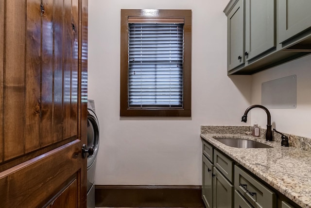 146 Long Island Dr, Eatonton, GA 31024 - washroom with cabinet space and washer / dryer