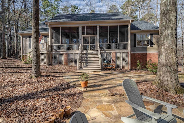 back of property featuring a sunroom