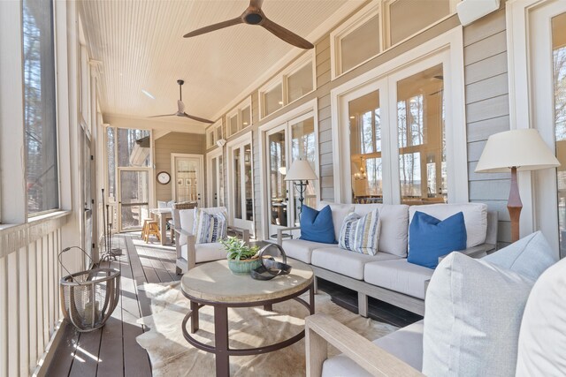 sunroom / solarium featuring wooden ceiling and ceiling fan