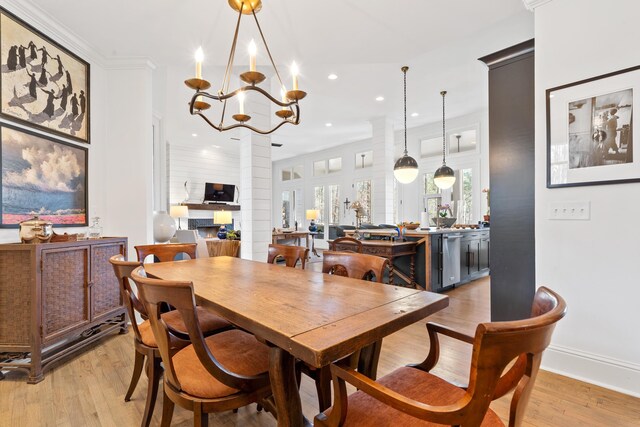 dining room with a notable chandelier and light hardwood / wood-style flooring