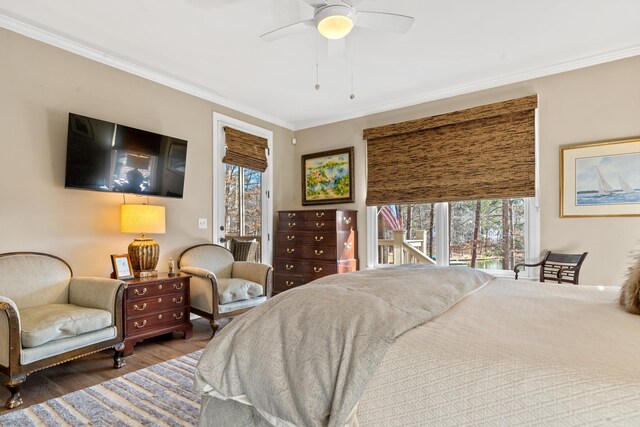 bedroom with hardwood / wood-style flooring, ornamental molding, access to exterior, and ceiling fan