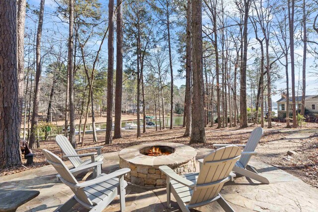 view of patio / terrace featuring an outdoor fire pit