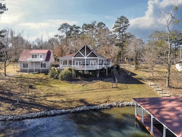 163 Knight Dr, Milledgeville, GA 31061 - back of house with metal roof and a deck with water view