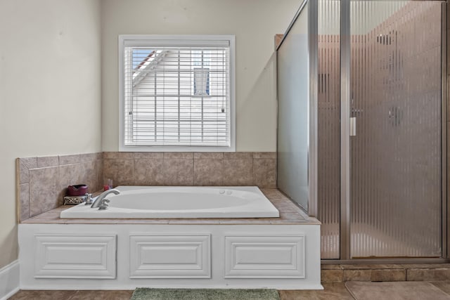 163 Knight Dr, Milledgeville, GA 31061 - bathroom featuring a stall shower, a bath, and tile patterned flooring