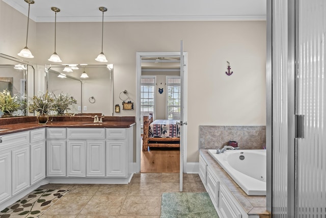 163 Knight Dr, Milledgeville, GA 31061 - bathroom with crown molding, a whirlpool tub, double vanity, ensuite bathroom, and tile patterned floors