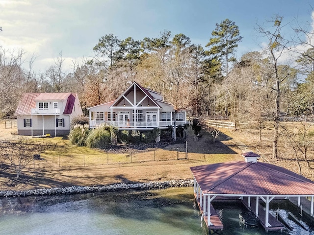 back of house featuring a water view