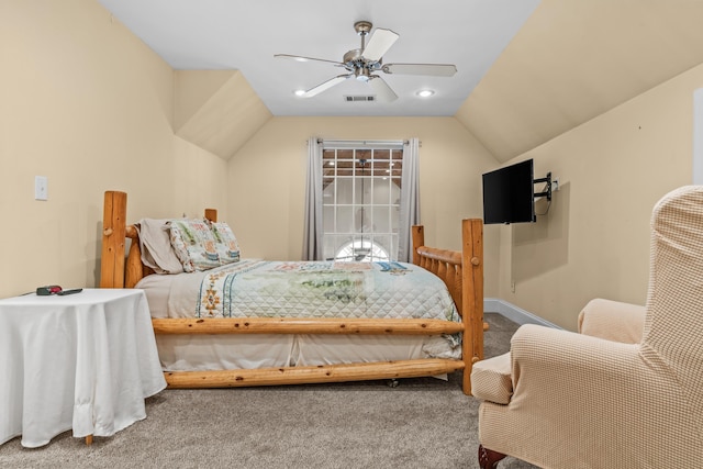 bedroom with vaulted ceiling, ceiling fan, and carpet flooring