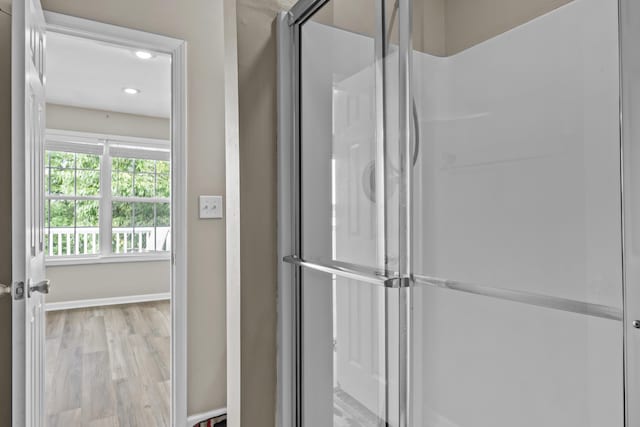163 Knight Dr, Milledgeville, GA 31061 - full bath with a shower stall, wood finished floors, recessed lighting, and baseboards